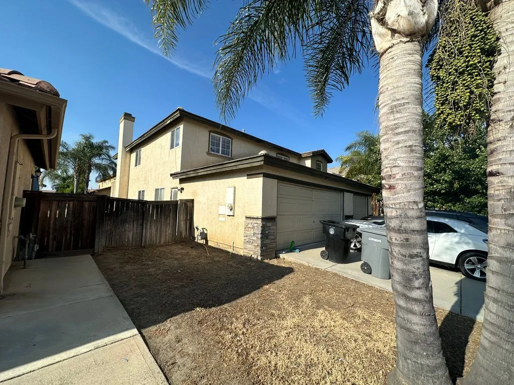 Side and rear exterior of 4630 Ferngreen Drive in Hemet, California