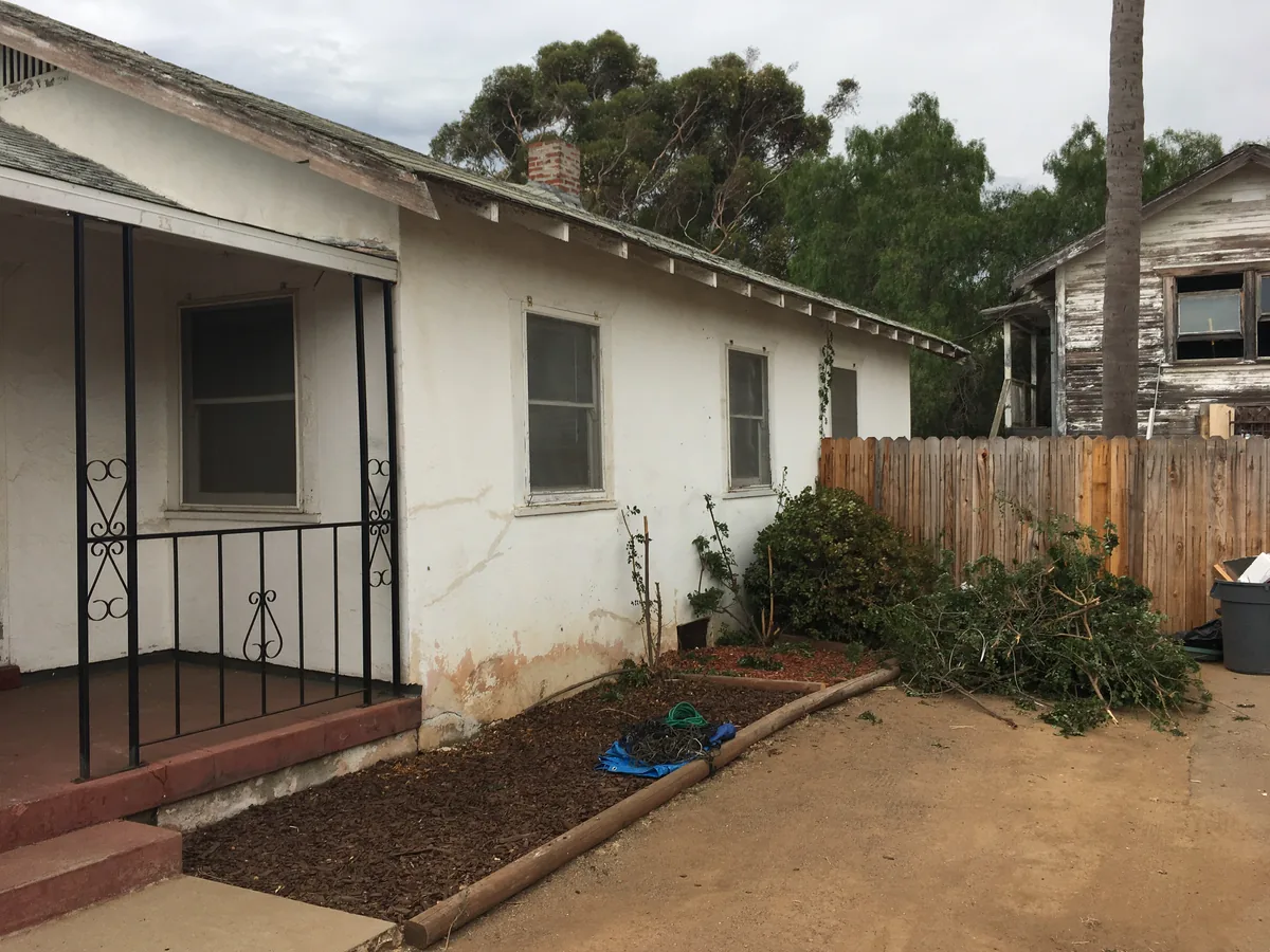 Exterior of the house and fenced yard at 143 Minot Avenue in Chula Vista