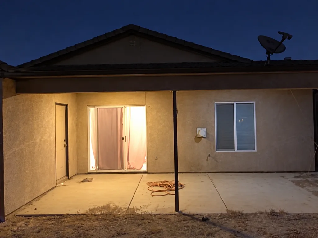 AI-enhanced rear exterior photo of the Siena Lane property in Bakersfield