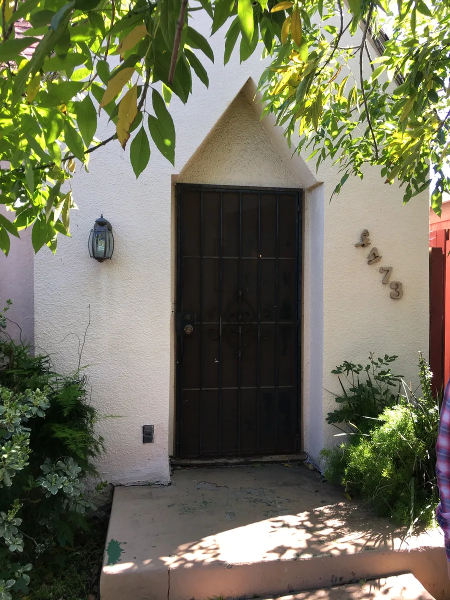 Arched front entry and house numbers at 4473 Wilson Avenue in San Diego